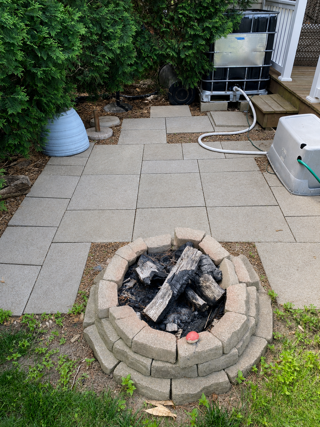 Patio pavers and fire pit after pressure washing