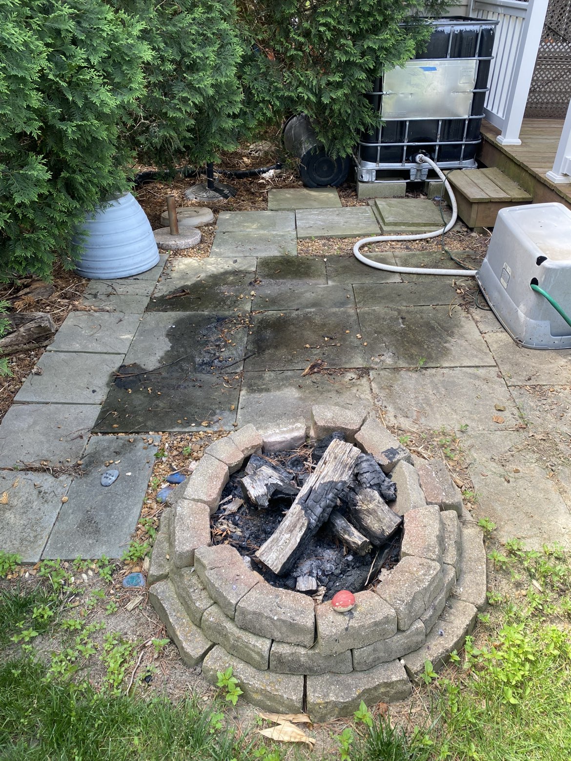 Patio pavers and fire pit before pressure washing